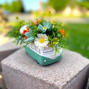 Small camper van with sola wood flowers